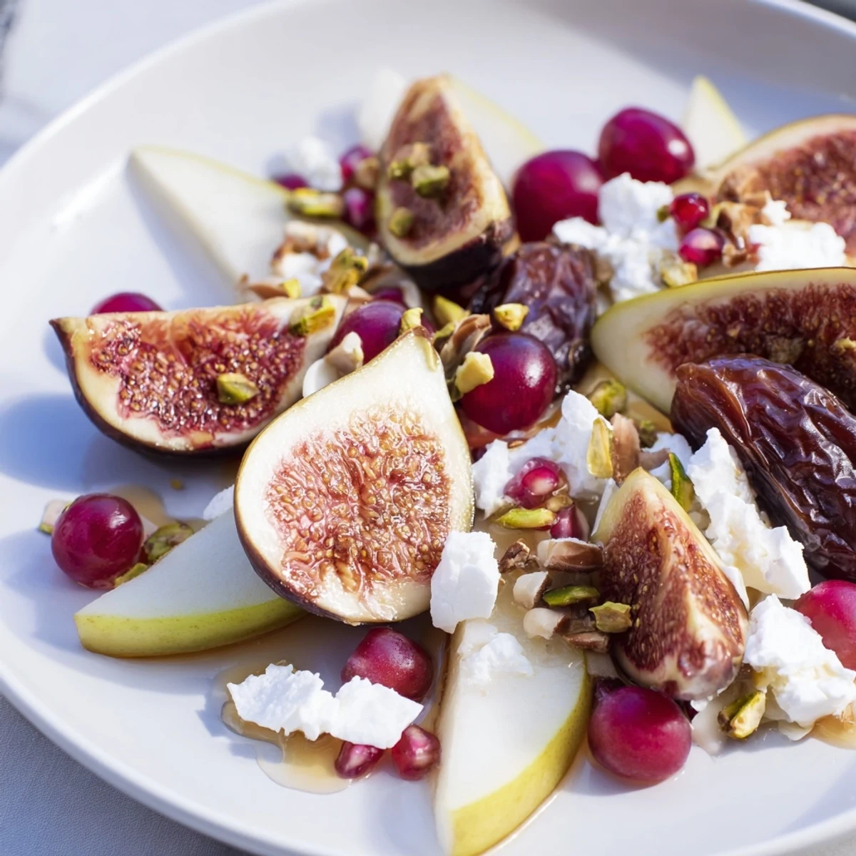 Winter fruit platter with jewel-toned fruits, coconut snowdrift, and a honey drizzle for dessert.
