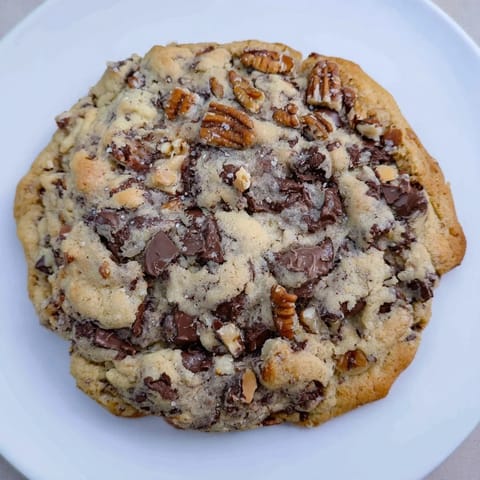 Freshly baked classic chocolate chip cookies, with melty chocolate and a beautiful soft texture.