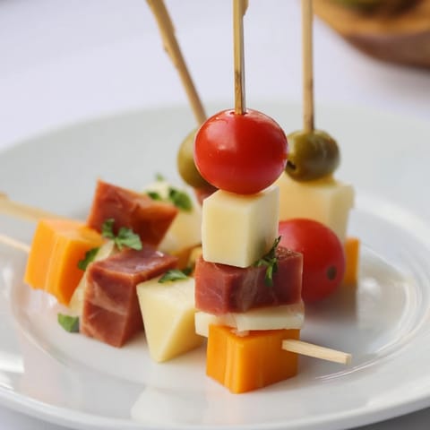 Delicious Savory Skewers assembly, featuring smoky turkey and cheddar cheese atop each skewer.