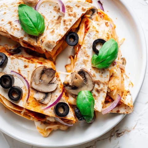 Folded Cheesy Tortilla Pizza Wrap with oozing cheese, perfect for a quick and simple lunch or snack.