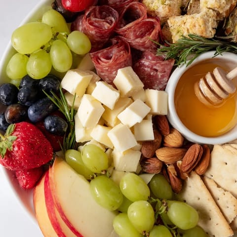 A beautifully arranged girl dinner with the quick charcuterie snack board, inviting flavors and textures.