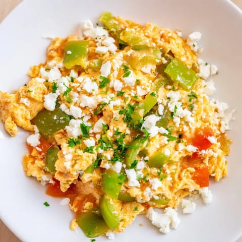 Golden, gently scrambled eggs mingling with fresh vegetables make up this hearty Turkish Menemen.