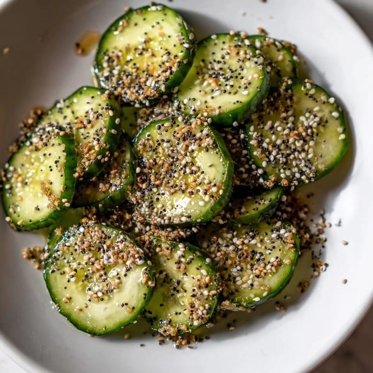 Close-up of a Cucumber Shaker seasoned and tossed: refreshing cucumber rounds with an irresistible everything bagel flavor.