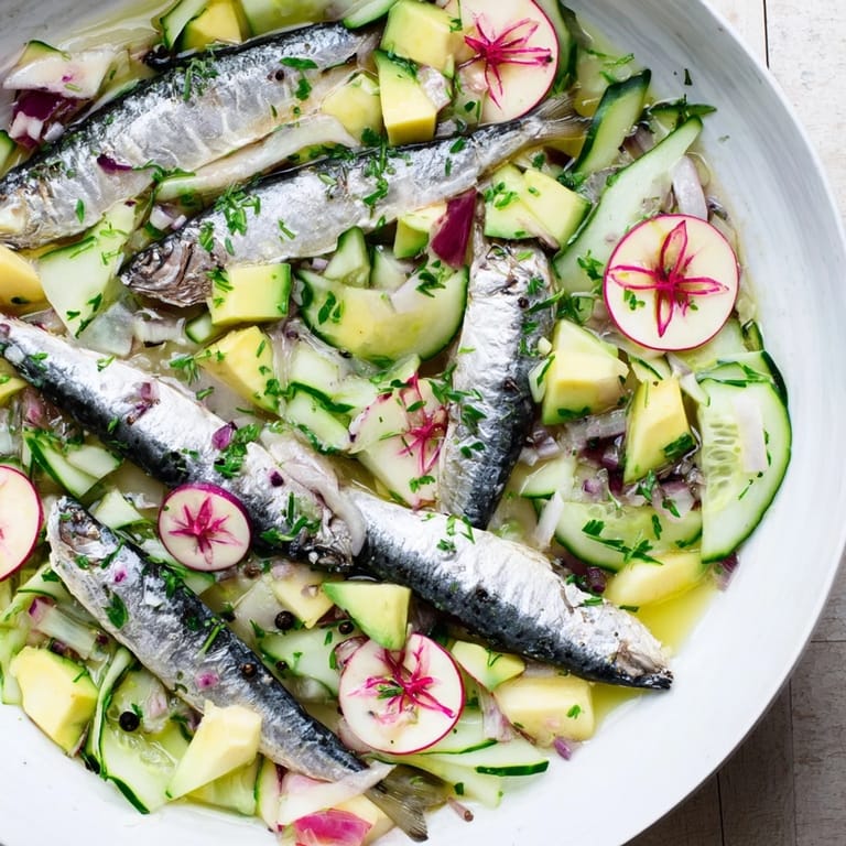 Refreshing Cucumber and Tinned Fish Date Night Salad, expertly layered with colorful vegetables and dressed to perfection; ready to serve!