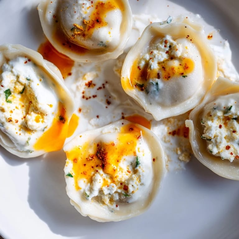 Close-up of golden brown Turkish Cheesy Manti, a delightful Turkish dish with cheese filling.