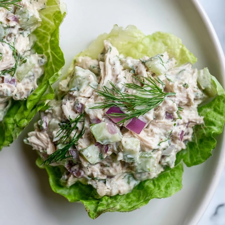 Easy homemade dill pickle chicken salad filling butter lettuce cups, perfect for quick gluten-free meal prep.