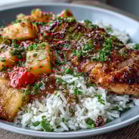 Grilled pineapple chicken and rice foil packets with juicy chicken, sweet pineapple, and colorful vegetables.