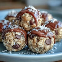 1. Easy No-Bake Oat Bites with Peanut Butter, a chewy, wholesome snack packed with oats, honey, and mini chocolate chips.  